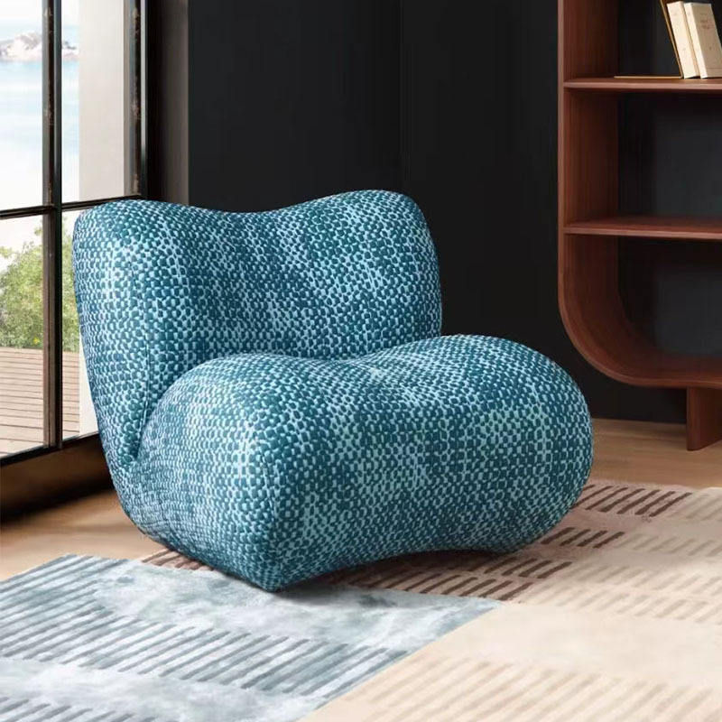 Blue Textured Lounge Chair with Curved Back and Deep Cushioned Seat