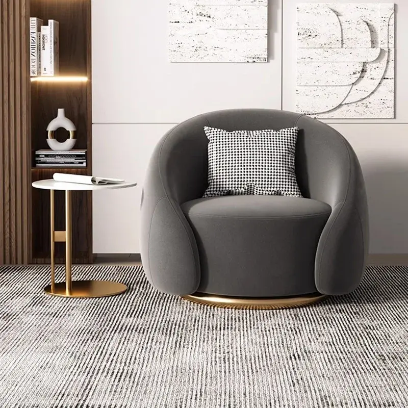 Gray Swivel Accent Chair with Curved Back and Gold Metal Base