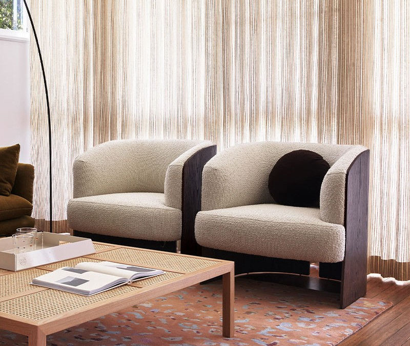 Cream Boucle Accent Chair with Curved Back and Dark Wood Side Panels