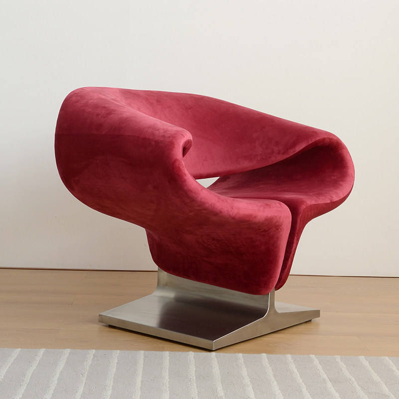 Red Velvet Accent Chair with Sculptural Ribbon Design and Metal Base