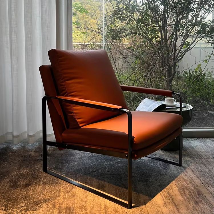 Brown Leather Lounge Chair with Reclined Back and Black Metal Frame