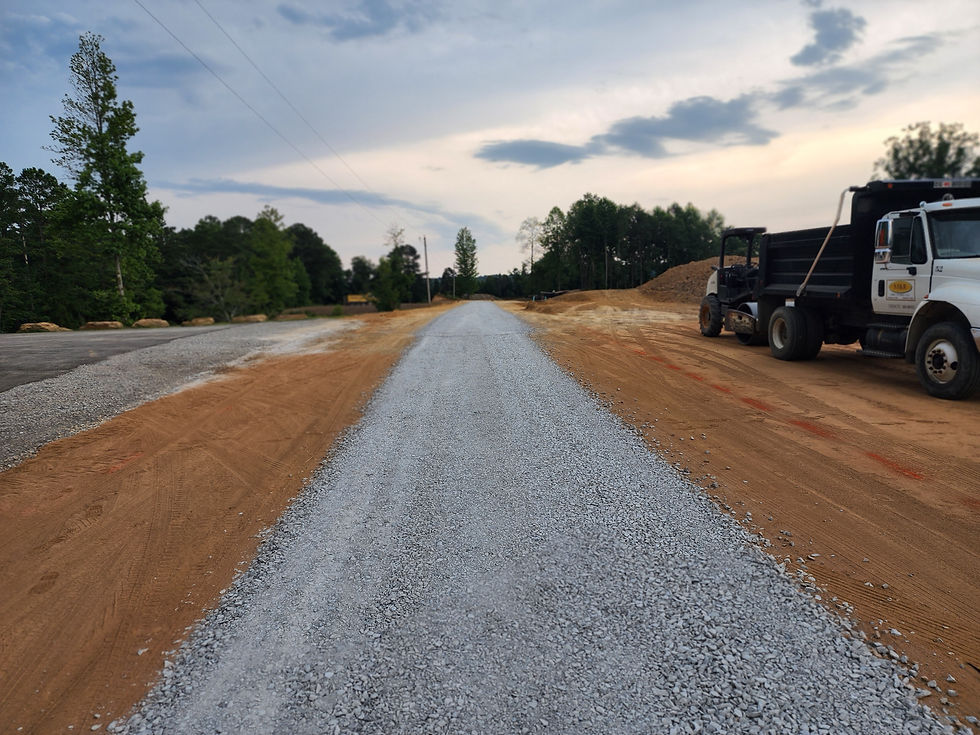 A fresh gravel driveway on a dirt pad.