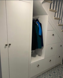 Under staircase storage cupboard