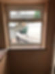 A plastered wall with a window