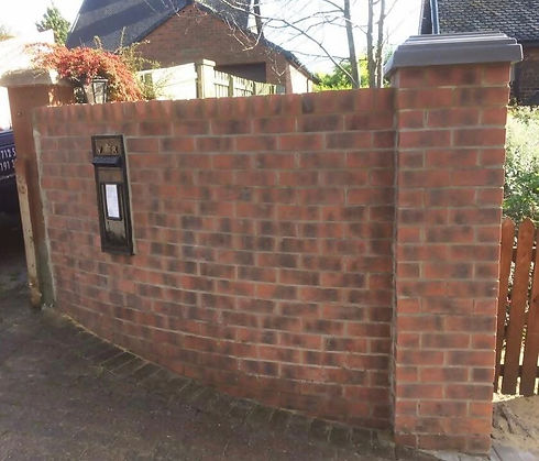 A newly built curved wall on the front of a home