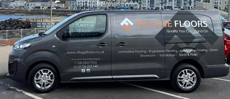 Village Floors van with logo and services information