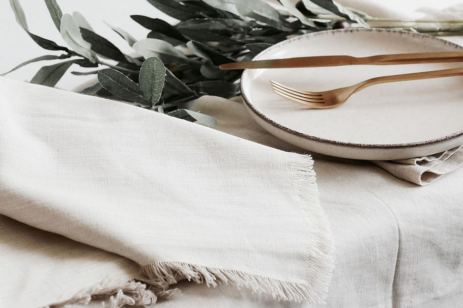 shutterstock_1987337501_table_linen_napkins_plate. low res.jpg