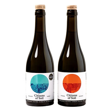 Citizens of Soil organic extra virgin olive oil duo, two dark glass bottles with teal Greek and orange Spanish labels