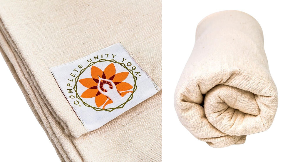 100% cotton cream yoga blanket with folded edges and a label reading "Complete Unity Yoga." Features an orange and white lotus logo; cozy and soft.