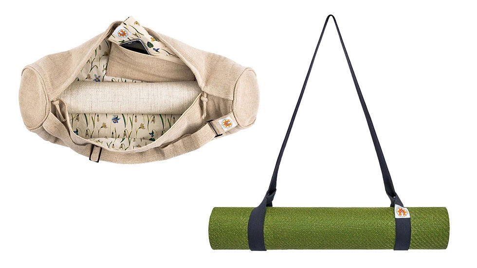 Complete unity yoga yoga bag with floral lining open, showing a neatly rolled mat inside. A separate complete unity yoga green yoga mat is strapped with black handles.