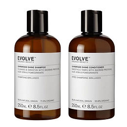 Evolve Organic Beauty Superfood Shine Shampoo and Conditioner duo in two 250ml amber glass bottles with white labels and black caps on a white background