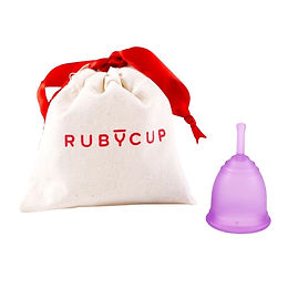 Ruby Cup menstrual cup in translucent purple medical grade silicone beside a cream cotton drawstring bag with red Ruby Cup logo and red ribbon tie on a white background