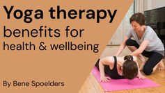 Yoga therapy benefits text overlay; Instructor assists woman on pink mat. Bright room with wooden floor. Mood: calm and focused.