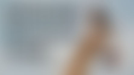 Hand holds "OSHUN" electrolyte bottle against sky. Text: "OSHUN Discount Code." Background is blue, mood is promotional.