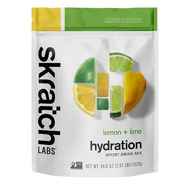 Skratch Labs hydration mix package with lemon and lime images, green and yellow top. Text: "lemon + lime," "hydration," "46.6 OZ."