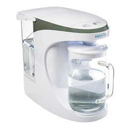 AquaTru countertop water filter with clear glass carafe filled with purified water