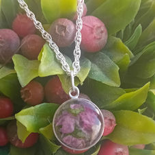 flowers set in resin memorial pendant