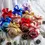 Thumbnail: Personalized glitter Christmas baubles made of plastic with custom name design, festive holiday tree ornaments.