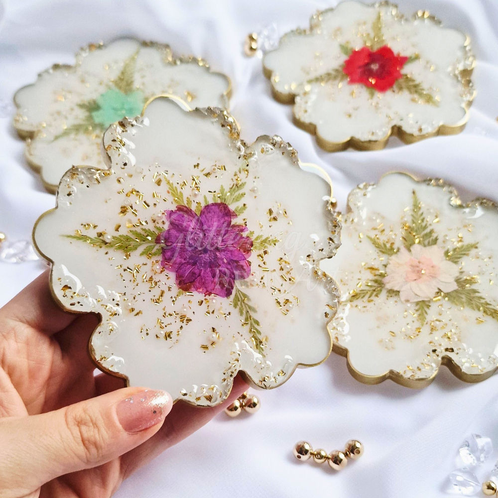 Handmade resin flower coasters with real dried flowers, sparkling crystals and pearls preserved in clear epoxy resin