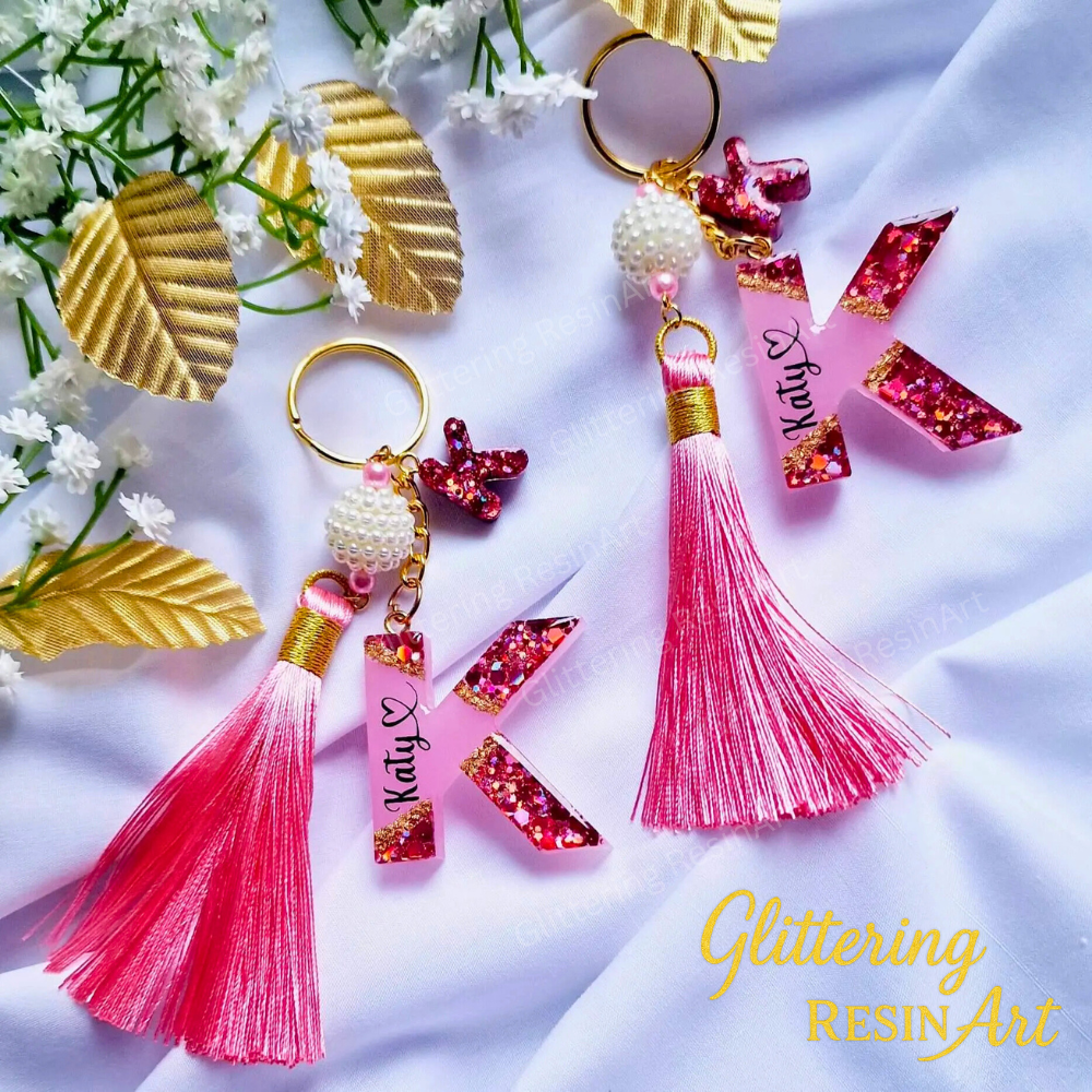 Handmade resin keychain with glitter; personalized with name. Colors available; perfect gift for her.