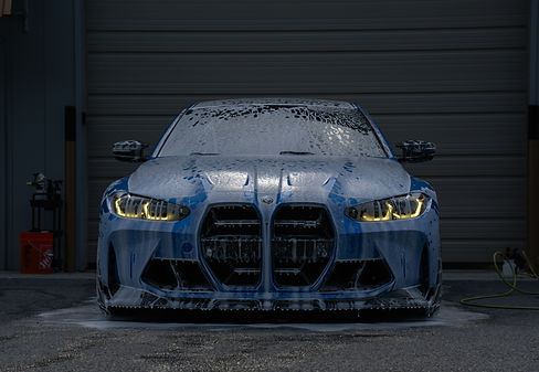 A blue BMW is getting a foamy car wash._edited.jpg