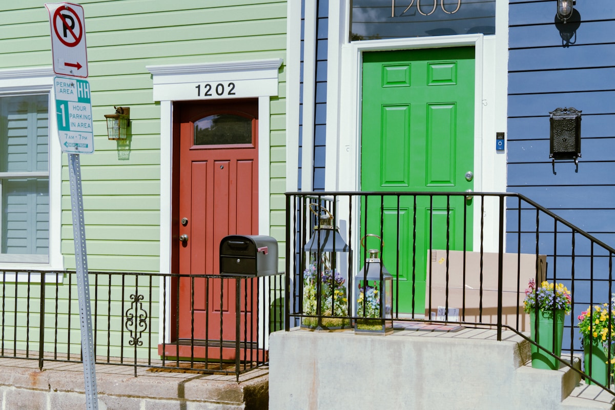 Row of attached townhomes representing the condo vs house decision for Lakewood, CO buyers