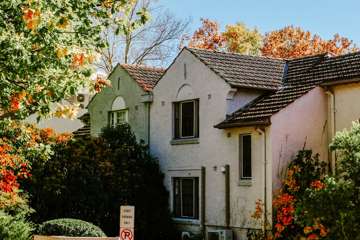 Suburban home surrounded by mature trees in the Bear Creek neighborhood of Lakewood, CO