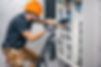 a-male-electrician-works-in-a-switchboard-with-an-2026-01-09-06-47-27-utc.jpg