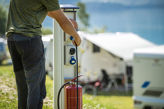 attaching-camper-rv-power-cable-to-camping-electri-2026-03-24-04-47-48-utc.jpg