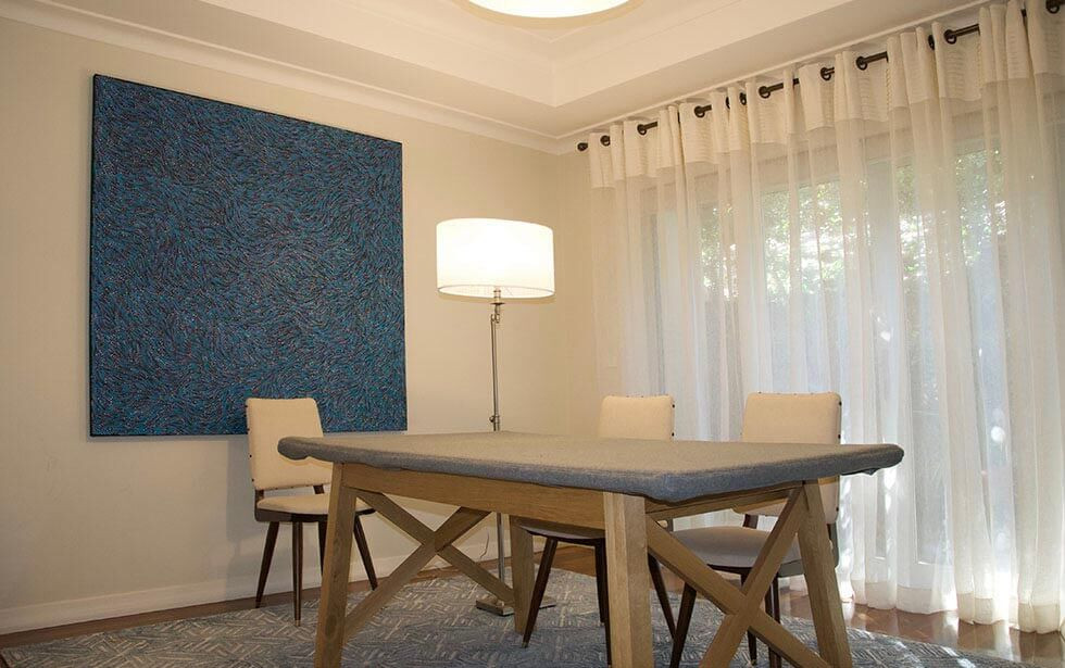 Curtains, Lighting, artwork & rug finish this room