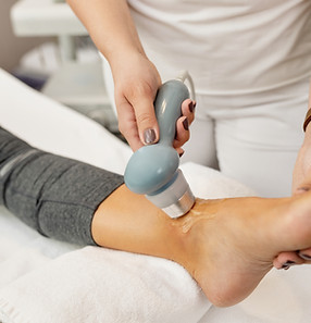 closeup-physical-therapist-treating-client-s-joint-with-electrotherapy.jpg