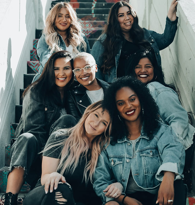 2 women sitting on black chair_edited.jpg