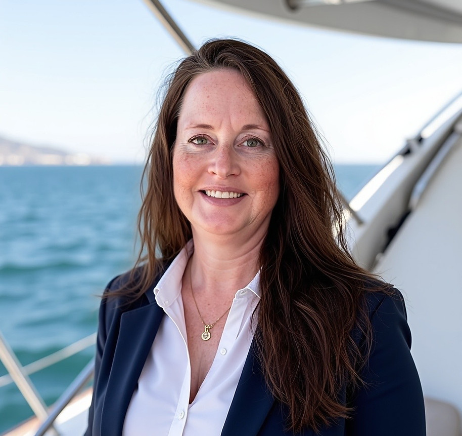 white, female therapist in professional attire on a boat