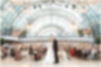 Indianapolis Artsgarden wedding reception photos under glass dome of bride and groom doing their first dance
