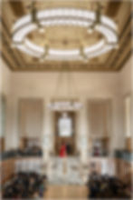 Wedding ceremony in the Simon Reading Room at Indianapolis Central Library with guests seated and floral decor