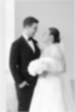 Bride and groom smiling on wedding day