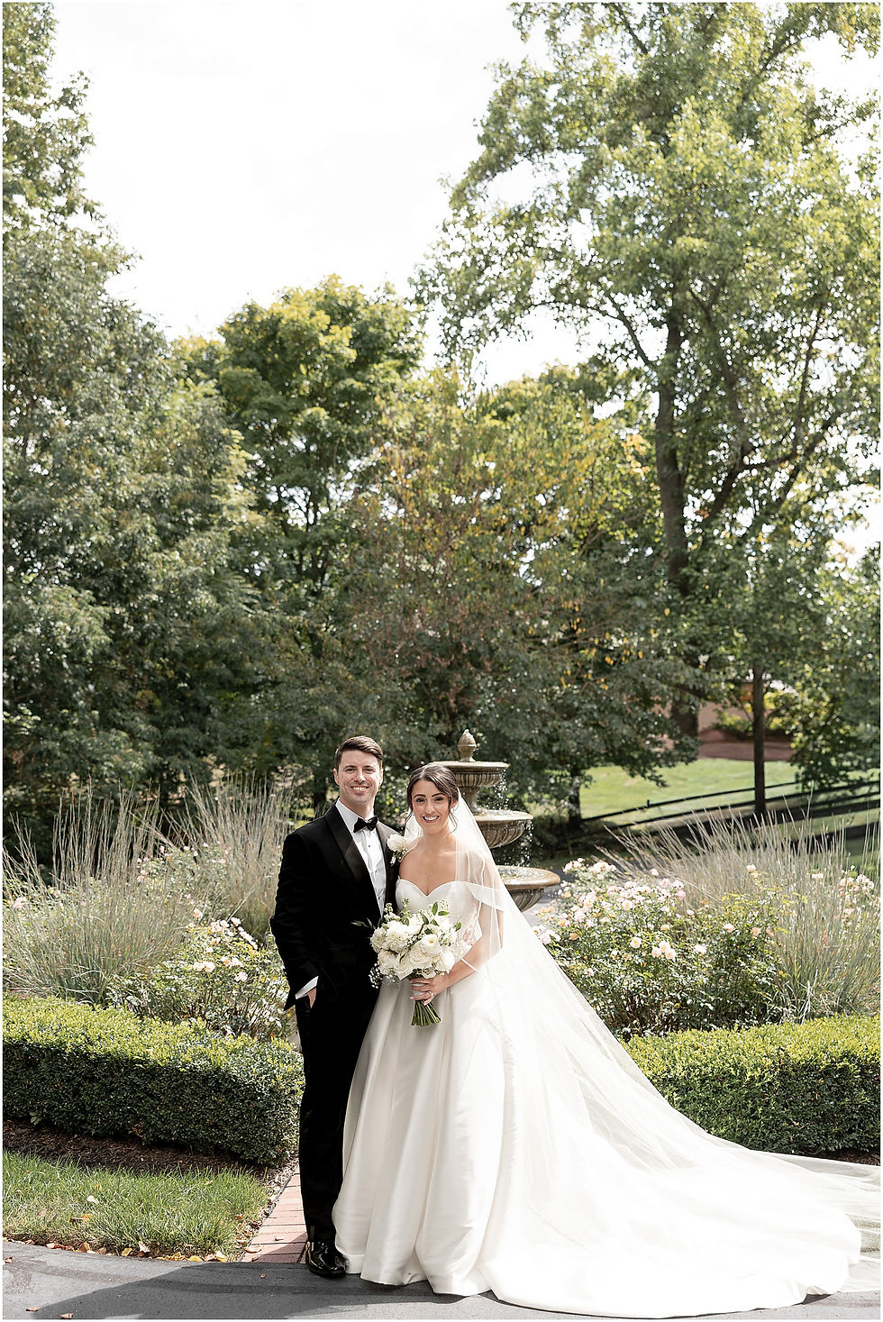 Indianapolis wedding pictures of bride and groom in front of fountain