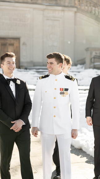Groom laughing with groomsmen