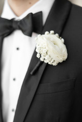 Close up photo of grooms boutonnière