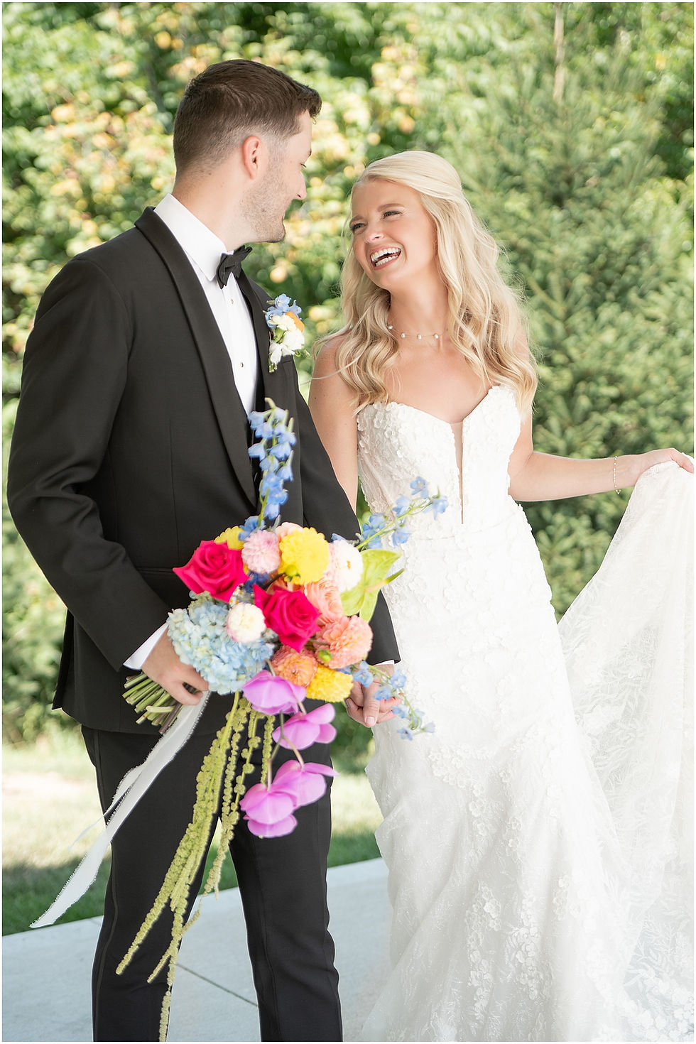 Bride and Groom laughing at wedding in Sixpence venue