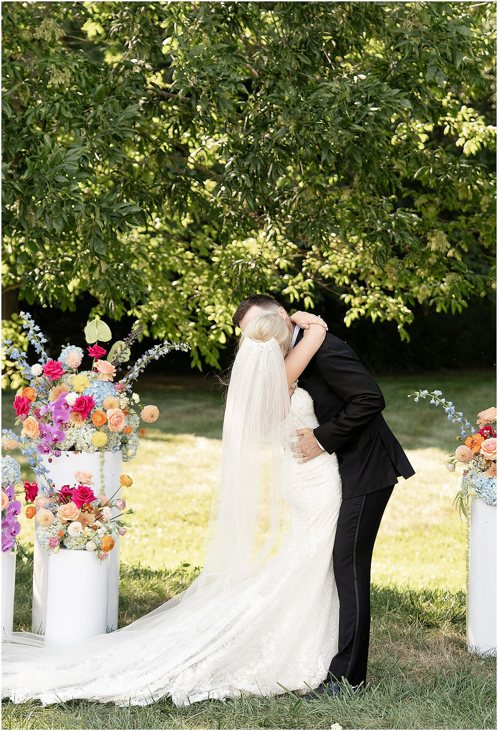 Bride and groom first kiss at wedding ceremony at The Sixpence in Whitestown Indiana