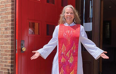 Susan in front of red doors.jpeg
