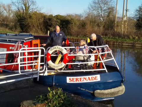 Three men on a canal boat Serenade