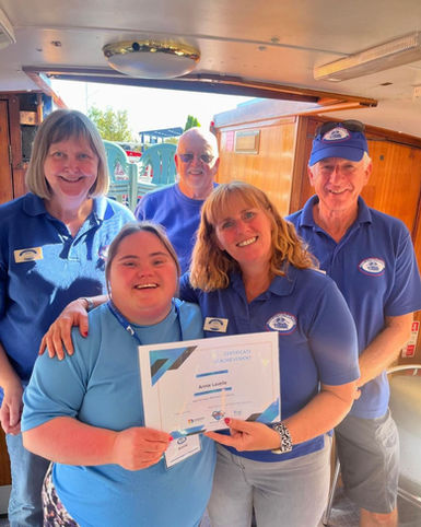 Woman receives award with team