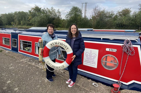 Two women by narrowboat Symphony, canal trip