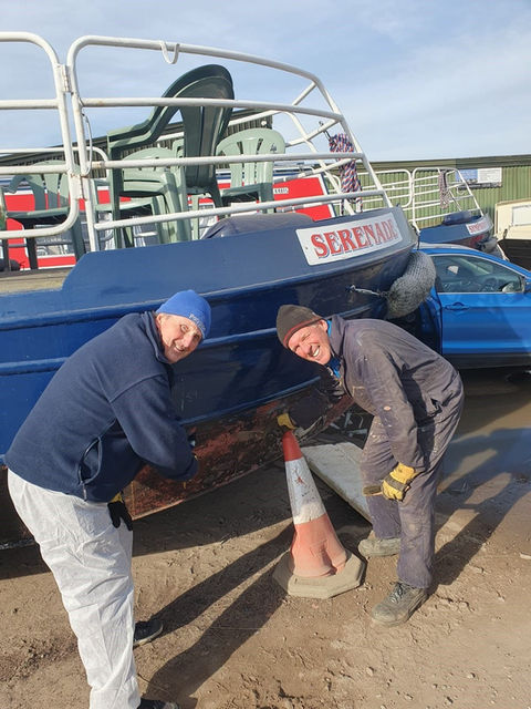 Two men servicing Seafrog boat