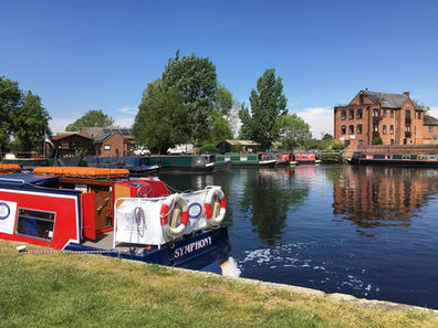 Narrowboat on sunny canal in Loughborough
