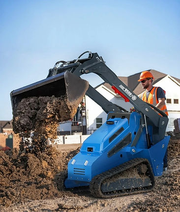 Rippa Mini Skid Steer being used to scoop dirt into a pile
