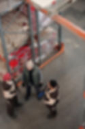 Workers in hi-vis in a positive warehouse environment
