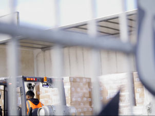forklift unloading behind epicurean dairy sign